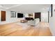 Finished basement with a lounge area, wet bar, and hardwood floors at 220 Glencoe St, Denver, CO 80220
