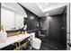 Modern bathroom featuring a sleek vanity, decorative lighting, and stylish glass shower at 220 Glencoe St, Denver, CO 80220