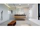 Relaxing bathroom featuring modern fixtures, spacious shower, and standalone tub at 220 Glencoe St, Denver, CO 80220