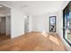 A light filled bedroom features hardwood floors, and ensuite bathroom at 220 Glencoe St, Denver, CO 80220