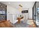 Elegant dining room featuring a modern chandelier, a glass table with seating for six, and light hardwood flooring at 220 Glencoe St, Denver, CO 80220