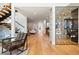 Spacious living area with a modern wine rack, sleek staircase, and hardwood floors at 220 Glencoe St, Denver, CO 80220