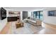 Spacious living room with bar area, comfortable sectional, and access to the outdoors at 220 Glencoe St, Denver, CO 80220
