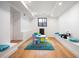 Bright playroom with colorful decor, hardwood floors, and comfortable seating area at 220 Glencoe St, Denver, CO 80220
