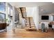 Modern staircase with wood treads, glass railings, and lots of natural light at 220 Glencoe St, Denver, CO 80220