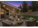 Inviting backyard patio with a fire pit and cozy seating, perfect for outdoor entertaining and relaxation at 2832 Danbury Ave, Highlands Ranch, CO 80126