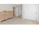 Neutral toned bedroom with carpet and closet doors, filled with wooden decor at 2832 Danbury Ave, Highlands Ranch, CO 80126