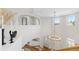 Dramatic foyer with a chandelier, hardwood floors, and an open balcony area at 2832 Danbury Ave, Highlands Ranch, CO 80126