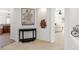 Hallway showcasing artistic displays and an archway leading to the main bedroom at 2832 Danbury Ave, Highlands Ranch, CO 80126