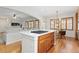 Open concept kitchen with a gas stove top island overlooking the living area at 2832 Danbury Ave, Highlands Ranch, CO 80126