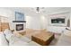 Cozy living room featuring a fireplace, plush sofa, and natural light at 2832 Danbury Ave, Highlands Ranch, CO 80126