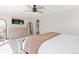 Serene main bedroom featuring a dresser, mirror, TV, and cozy bedding at 2832 Danbury Ave, Highlands Ranch, CO 80126
