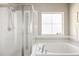 Clean bathroom with a shower and bathtub at 4942 Wabash St, Denver, CO 80238