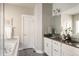 Elegant bathroom with double vanity, granite countertop, and soaking tub at 4942 Wabash St, Denver, CO 80238