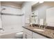 Clean bathroom, granite countertop, updated fixtures at 4942 Wabash St, Denver, CO 80238