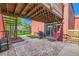 Cozy patio with string lights, grill, and hammock, perfect for outdoor entertaining at 6225 E Mississippi Ave, Denver, CO 80224