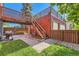 Backyard with patio, grill, and second-story deck, ideal for outdoor gatherings and relaxation at 6225 E Mississippi Ave, Denver, CO 80224