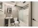Clean and modern bathroom featuring a shower, vanity, and toilet, creating a functional space at 6225 E Mississippi Ave, Denver, CO 80224