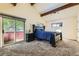 Bedroom with vaulted ceiling, private balcony, and comfortable carpet at 6225 E Mississippi Ave, Denver, CO 80224