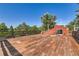 Large wooden deck featuring wooden railings and neighborhood views at 6225 E Mississippi Ave, Denver, CO 80224