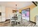Bright dining area with stylish decor, hardwood floors, and direct access to an outdoor patio at 6225 E Mississippi Ave, Denver, CO 80224