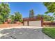 Spacious two-car garage with a large driveway and an overhead deck at 6225 E Mississippi Ave, Denver, CO 80224