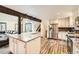 Well-lit kitchen with stainless steel appliances, granite counters, and an open layout with views of the living area at 6225 E Mississippi Ave, Denver, CO 80224