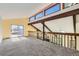 Spacious loft area with natural light, wood beams, and carpet, ideal for flexible living at 6225 E Mississippi Ave, Denver, CO 80224