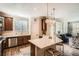 Bright kitchen with stainless steel appliances, marble countertops, and hardwood floors at 15496 W 66Th Dr # G, Arvada, CO 80007