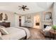 Main bedroom with fireplace, and en suite bath at 15496 W 66Th Dr # G, Arvada, CO 80007