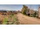 Scenic path lined with mature trees and vegetation offering a peaceful escape at 15496 W 66Th Dr # G, Arvada, CO 80007