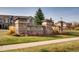 Hometown community entrance sign surrounded by mature landscaping and lush green grass at 15496 W 66Th Dr # G, Arvada, CO 80007