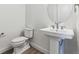 Modern bathroom with pedestal sink, toilet and shower at 8845 Yellowcress St, Littleton, CO 80125