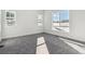 Bright bedroom with gray carpeting and large windows at 8845 Yellowcress St, Littleton, CO 80125