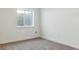 Simple bedroom with grey carpet and window at 8845 Yellowcress St, Littleton, CO 80125