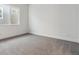 Bright bedroom with grey carpet and window at 8845 Yellowcress St, Littleton, CO 80125