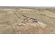 Expansive aerial view of the property showcasing its acreage, outbuildings, and serene rural setting at 1632 S County Road 137, Bennett, CO 80102
