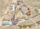 Aerial view showcases the house with a red deck and various outbuildings, including a large garage at 1632 S County Road 137, Bennett, CO 80102