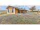 A large backyard with a covered patio, providing an inviting space for outdoor gatherings and relaxation at 1632 S County Road 137, Bennett, CO 80102
