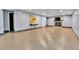 Finished basement featuring a brick fireplace and wood-look floors, ideal for a cozy living space at 1632 S County Road 137, Bennett, CO 80102