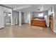 Unfinished basement with stone accents, neutral paint, a bed, and potential for customization at 1632 S County Road 137, Bennett, CO 80102