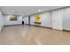 A large, unfinished basement provides versatility, with wood-look flooring and neutral paint at 1632 S County Road 137, Bennett, CO 80102