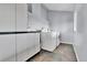 A clean laundry room features a modern washer and dryer and practical storage solutions at 1632 S County Road 137, Bennett, CO 80102
