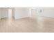 Open basement space with a view to the basement bathroom and side window at 13971 Star Creek Dr, Broomfield, CO 80023