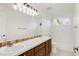 Spacious bathroom featuring double sinks and a large mirror and lots of light at 13971 Star Creek Dr, Broomfield, CO 80023