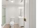 A clean bathroom featuring a glass shower, toilet, and vanity with stylish hardware at 13971 Star Creek Dr, Broomfield, CO 80023