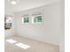 Bright bedroom with windows with mini blinds and neutral carpet at 13971 Star Creek Dr, Broomfield, CO 80023