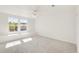 Bright bedroom with a bench under the windows and neutral carpet at 13971 Star Creek Dr, Broomfield, CO 80023