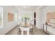 Elegant dining room featuring a modern table setting, French doors leading to the outside, and bright natural light at 13971 Star Creek Dr, Broomfield, CO 80023