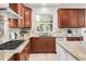 Modern kitchen with granite countertops, stainless appliances, and stylish backsplash at 13971 Star Creek Dr, Broomfield, CO 80023